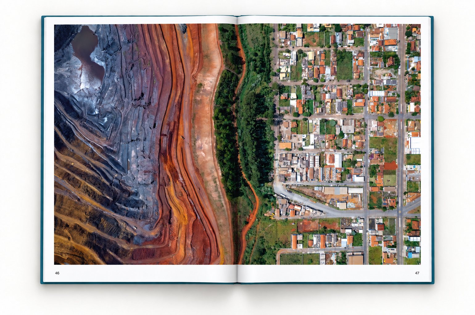 The book open at pages 46 and 47. One photograph runs across both pages: the terraced red and gray walls of an open-pit iron-ore mine run up to the street grid of Jardim Canadá.