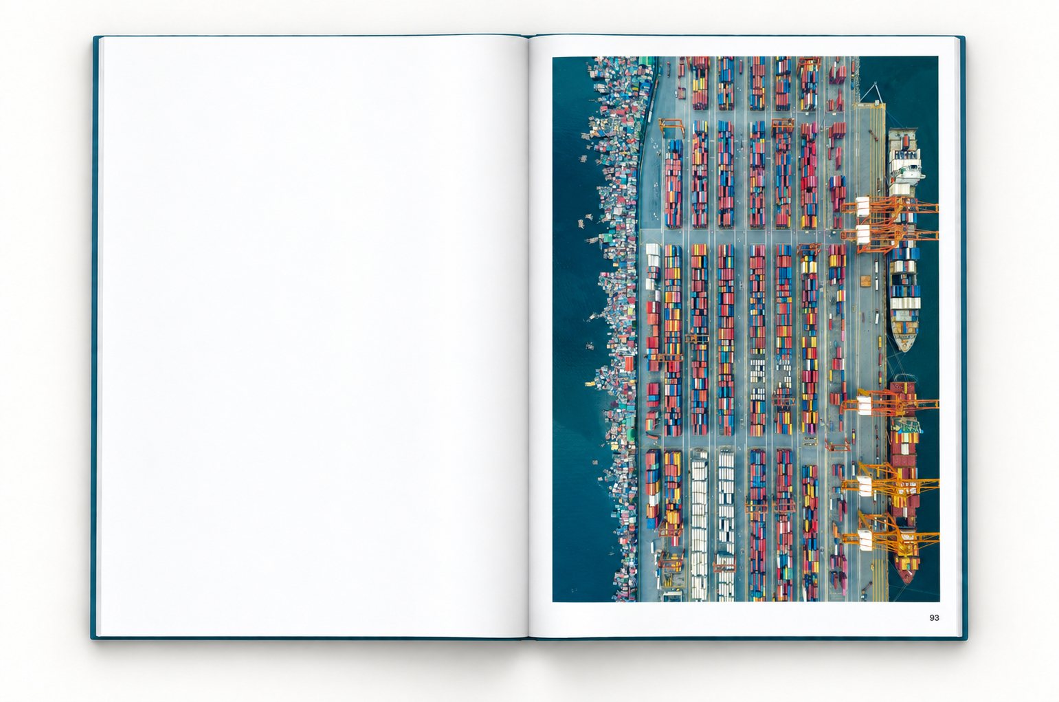 The book open at page 93, the left page blank. Rows of shipping containers and cranes fill a port terminal, with ships at the quay on one side and houses on stilts crowding the water on the other.