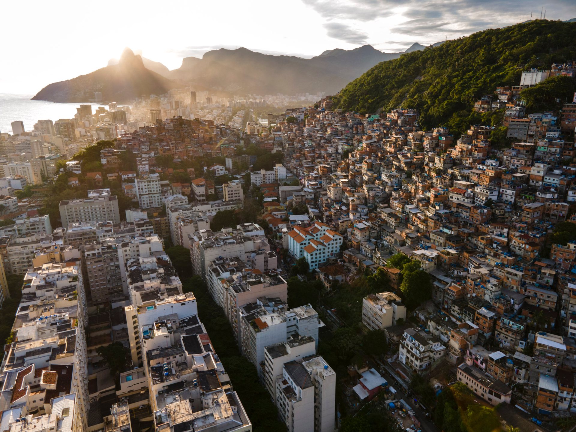 slums and hotels at sunset, Copacabana Beach, Rio de Janeiro Brazil.