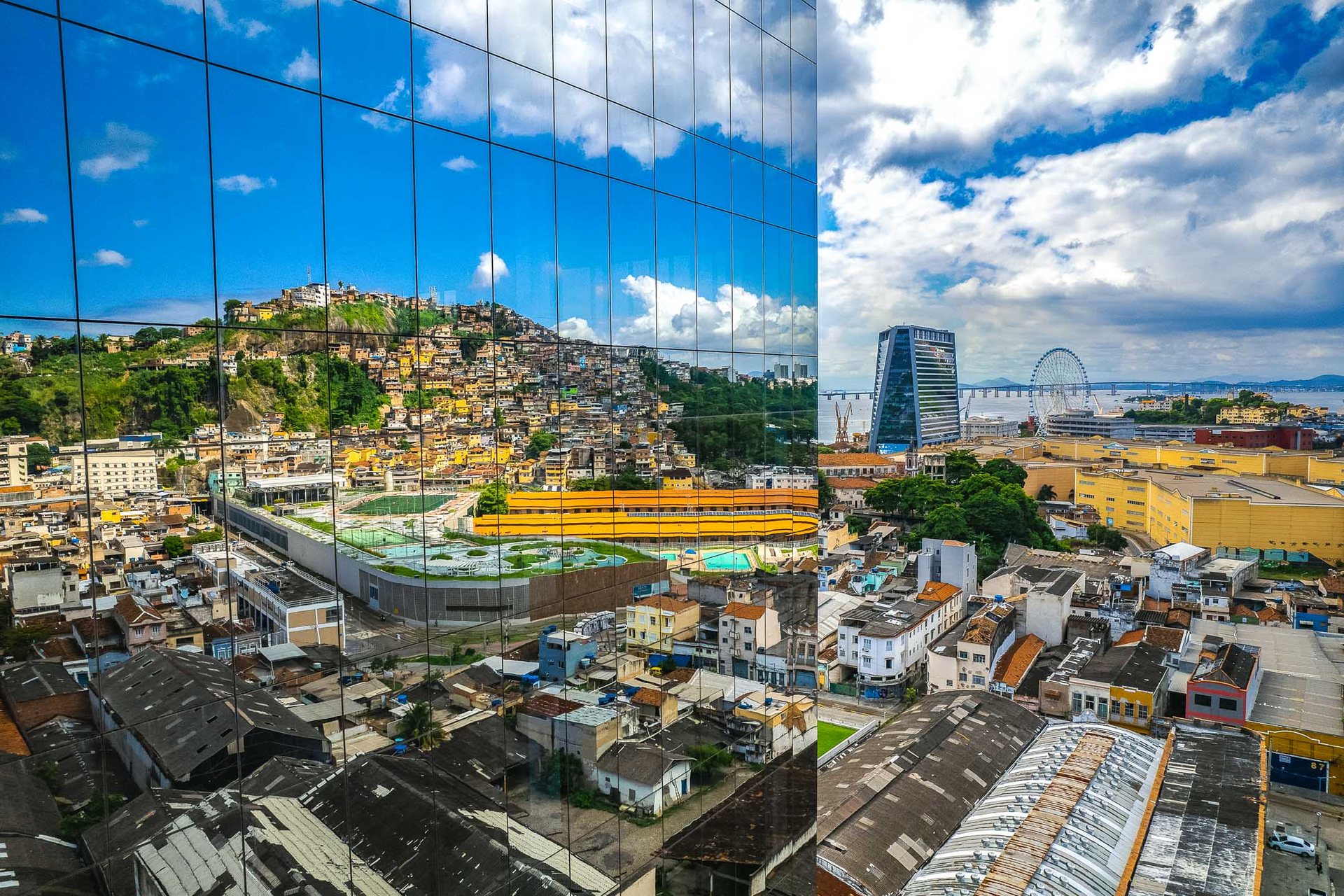 The reflection of Morro de Providencia favela in the windows of an office building in Rio's downtown.
