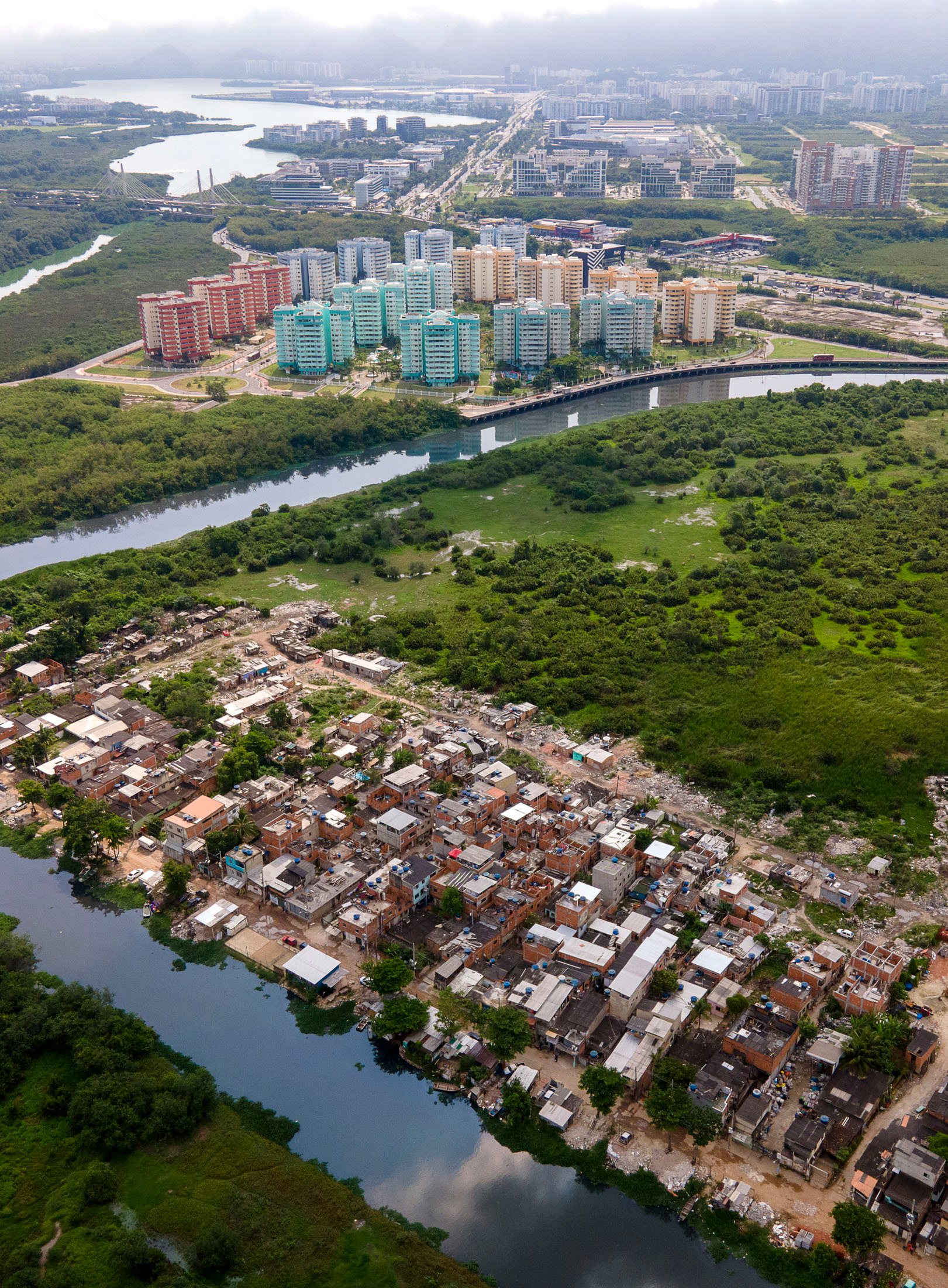 Colorful Olympic housing next to an informal settlement in Rio's mangroves.