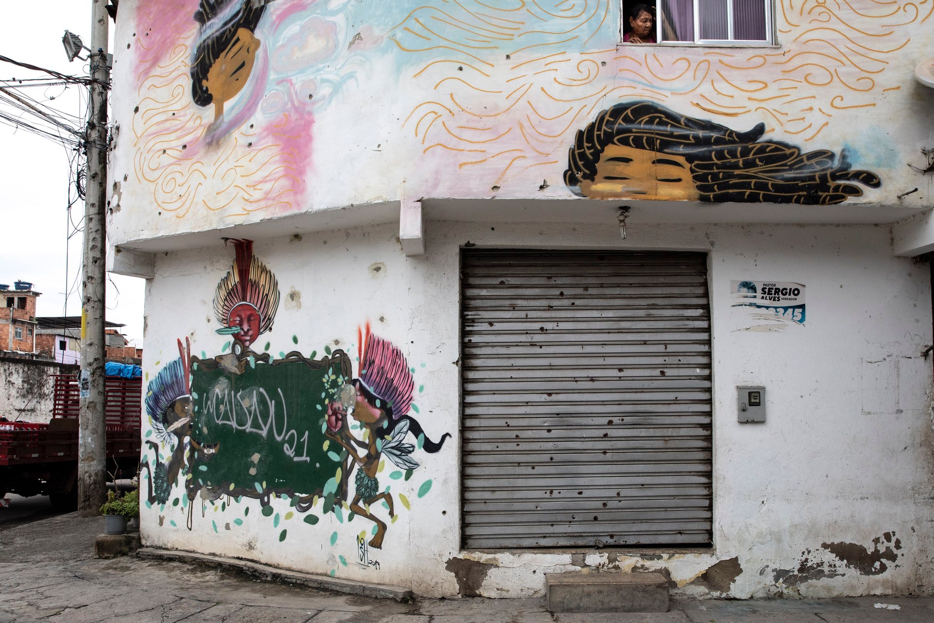Bullet pock marked walls in the favela of Maré.